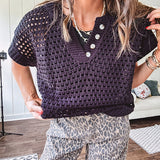 Black open knit sweater with short sleeves, four buttons down the V neck and ribbed hem and cuffs.