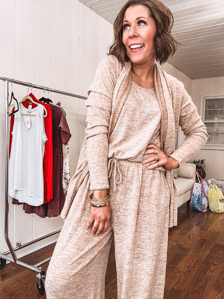 Soft knit 3 piece set featuring a heathered taupe color, a tank, an open front cardigan and wide leg elastic waist pants.