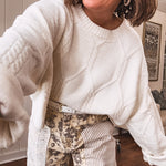 Ivory cable knit cropped sweater.