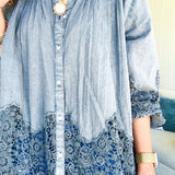 Lightweight washed long sleeved button down top with pleating at the yoke, lace detail on the sleeves and above the hem and elastic cuffs, flowy design.