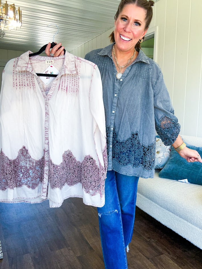 Lightweight washed long sleeved button down top with pleating at the yoke, lace detail on the sleeves and above the hem and elastic cuffs, flowy design.