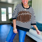 Soft, terry-like black and white striped half sleeve top with oversized leopard print football applique on the front, black trim at the round neck, cuffs and wide hem.