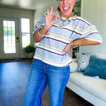 Taupe, light blue, mulberry and cream striped lightweight short sleeved tee with taupe trim at the round neck and seams and a boxy cut.