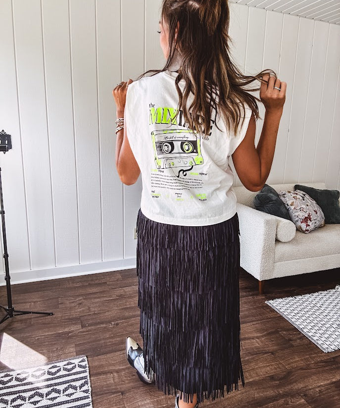 Soft, cream cotton muscle tank that's basically a love letter to the golden age of mixtapes. Rock the bold black "the Mixtape club" graphic up front, then flip around to reveal a striking black and neon yellow design featuring an actual tape and the real definition of what makes a mixtape so legendary