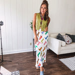 A western-inspired bias midi skirt that brings playful attitude to every outfit. Featuring a bold cowboy boot print on a creamy background, it's designed for effortless movement with a comfortable wide-band elastic waist and full lining