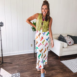 A western-inspired bias midi skirt that brings playful attitude to every outfit. Featuring a bold cowboy boot print on a creamy background, it's designed for effortless movement with a comfortable wide-band elastic waist and full lining