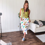 A western-inspired bias midi skirt that brings playful attitude to every outfit. Featuring a bold cowboy boot print on a creamy background, it's designed for effortless movement with a comfortable wide-band elastic waist and full lining