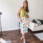 A western-inspired bias midi skirt that brings playful attitude to every outfit. Featuring a bold cowboy boot print on a creamy background, it's designed for effortless movement with a comfortable wide-band elastic waist and full lining
