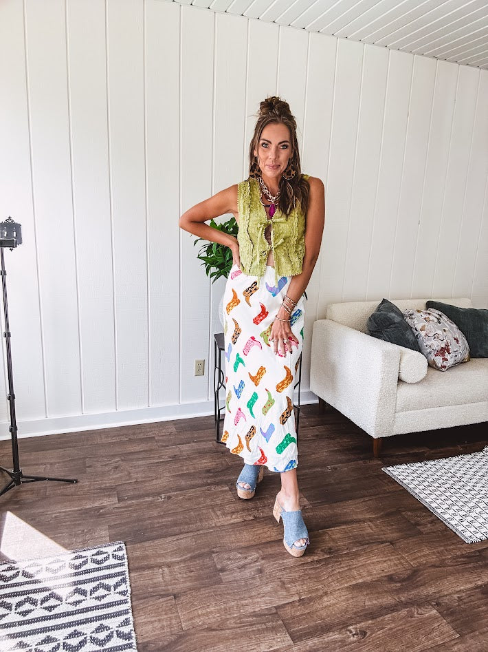 A western-inspired bias midi skirt that brings playful attitude to every outfit. Featuring a bold cowboy boot print on a creamy background, it's designed for effortless movement with a comfortable wide-band elastic waist and full lining