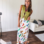 A western-inspired bias midi skirt that brings playful attitude to every outfit. Featuring a bold cowboy boot print on a creamy background, it's designed for effortless movement with a comfortable wide-band elastic waist and full lining