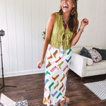 A western-inspired bias midi skirt that brings playful attitude to every outfit. Featuring a bold cowboy boot print on a creamy background, it's designed for effortless movement with a comfortable wide-band elastic waist and full lining
