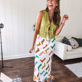 A western-inspired bias midi skirt that brings playful attitude to every outfit. Featuring a bold cowboy boot print on a creamy background, it's designed for effortless movement with a comfortable wide-band elastic waist and full lining