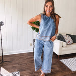 Light wash denim set that's equal parts effortless and eye-catching. The tank features a hook-and-eye neck closure and loose hem, while caramel embroidered stitching adds personality throughout. Pair it with the matching wide-leg pants—complete with button-zip closure, elastic back waist, front and side pleating, and pockets lined with the same playful embroidered detail.