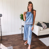 Light wash denim set that's equal parts effortless and eye-catching. The tank features a hook-and-eye neck closure and loose hem, while caramel embroidered stitching adds personality throughout. Pair it with the matching wide-leg pants—complete with button-zip closure, elastic back waist, front and side pleating, and pockets lined with the same playful embroidered detail.