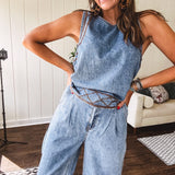 Light wash denim set that's equal parts effortless and eye-catching. The tank features a hook-and-eye neck closure and loose hem, while caramel embroidered stitching adds personality throughout. Pair it with the matching wide-leg pants—complete with button-zip closure, elastic back waist, front and side pleating, and pockets lined with the same playful embroidered detail.