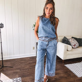 Light wash denim set that's equal parts effortless and eye-catching. The tank features a hook-and-eye neck closure and loose hem, while caramel embroidered stitching adds personality throughout. Pair it with the matching wide-leg pants—complete with button-zip closure, elastic back waist, front and side pleating, and pockets lined with the same playful embroidered detail.