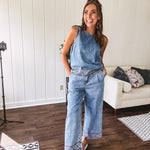 Light wash denim set that's equal parts effortless and eye-catching. The tank features a hook-and-eye neck closure and loose hem, while caramel embroidered stitching adds personality throughout. Pair it with the matching wide-leg pants—complete with button-zip closure, elastic back waist, front and side pleating, and pockets lined with the same playful embroidered detail.