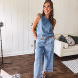 Light wash denim set that's equal parts effortless and eye-catching. The tank features a hook-and-eye neck closure and loose hem, while caramel embroidered stitching adds personality throughout. Pair it with the matching wide-leg pants—complete with button-zip closure, elastic back waist, front and side pleating, and pockets lined with the same playful embroidered detail.