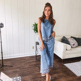 Light wash denim set that's equal parts effortless and eye-catching. The tank features a hook-and-eye neck closure and loose hem, while caramel embroidered stitching adds personality throughout. Pair it with the matching wide-leg pants—complete with button-zip closure, elastic back waist, front and side pleating, and pockets lined with the same playful embroidered detail.