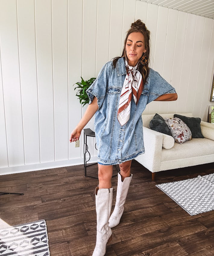 Denim Diva energy meets versatile style. This batwing beauty shifts from jacket to shirt to dress—layer it over everything or let it stand solo. Medium wash, metal button details, and flattering seam work make it endlessly cool. 
