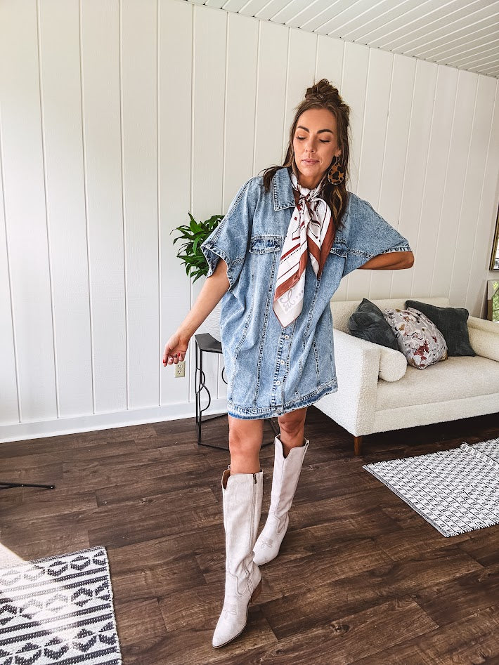 Denim Diva energy meets versatile style. This batwing beauty shifts from jacket to shirt to dress—layer it over everything or let it stand solo. Medium wash, metal button details, and flattering seam work make it endlessly cool. 