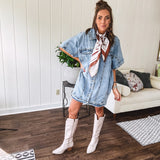Denim Diva energy meets versatile style. This batwing beauty shifts from jacket to shirt to dress—layer it over everything or let it stand solo. Medium wash, metal button details, and flattering seam work make it endlessly cool. 