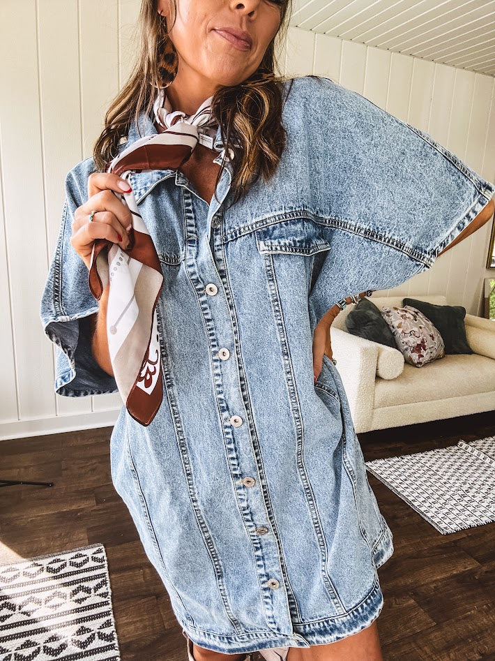 Denim Diva energy meets versatile style. This batwing beauty shifts from jacket to shirt to dress—layer it over everything or let it stand solo. Medium wash, metal button details, and flattering seam work make it endlessly cool. 