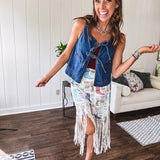 Medium wash denim vest is your new go-to layer. The open front with playful tie closures and contrast-stitched pockets.