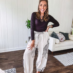 This black baby rib top is your new closet essential. The delicate lace inset at the V neckline adds just enough intrigue, while the ribbed texture and generous stretch make it impossibly comfortable.