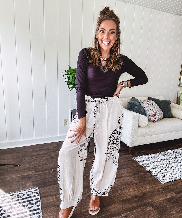 This black baby rib top is your new closet essential. The delicate lace inset at the V neckline adds just enough intrigue, while the ribbed texture and generous stretch make it impossibly comfortable.