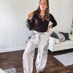 This black baby rib top is your new closet essential. The delicate lace inset at the V neckline adds just enough intrigue, while the ribbed texture and generous stretch make it impossibly comfortable.