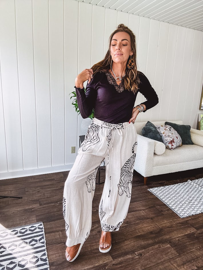 This black baby rib top is your new closet essential. The delicate lace inset at the V neckline adds just enough intrigue, while the ribbed texture and generous stretch make it impossibly comfortable.