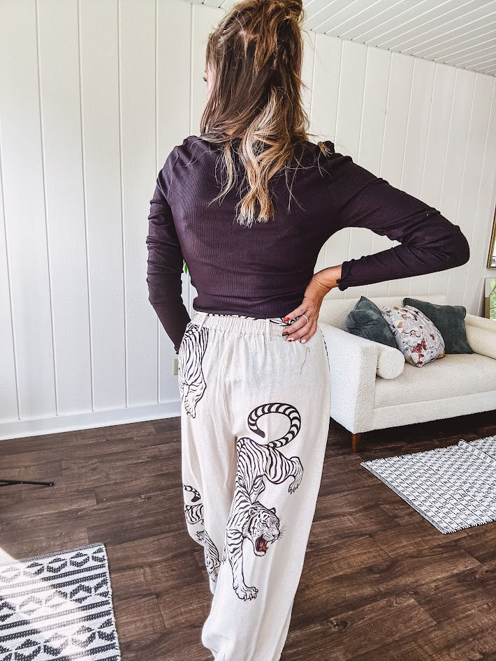 This black baby rib top is your new closet essential. The delicate lace inset at the V neckline adds just enough intrigue, while the ribbed texture and generous stretch make it impossibly comfortable.