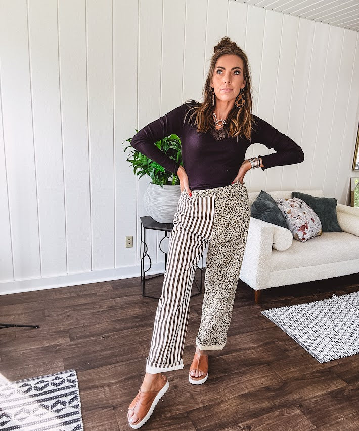  The MIX MATCH LEOPARD STRIPE PANT blends bold brown and cream stripes on one leg with fierce leopard print on the other—all in a soft, denim-like fabric that feels as good as it looks. The elastic back waist keeps you comfy while the button and zipper front keeps things polished. 