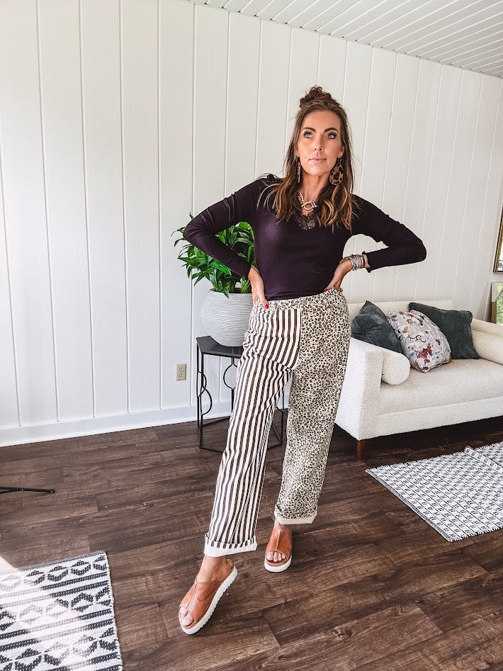  The MIX MATCH LEOPARD STRIPE PANT blends bold brown and cream stripes on one leg with fierce leopard print on the other—all in a soft, denim-like fabric that feels as good as it looks. The elastic back waist keeps you comfy while the button and zipper front keeps things polished. 