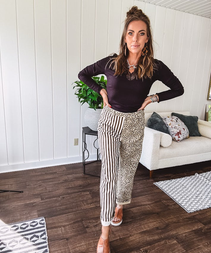  The MIX MATCH LEOPARD STRIPE PANT blends bold brown and cream stripes on one leg with fierce leopard print on the other—all in a soft, denim-like fabric that feels as good as it looks. The elastic back waist keeps you comfy while the button and zipper front keeps things polished. 