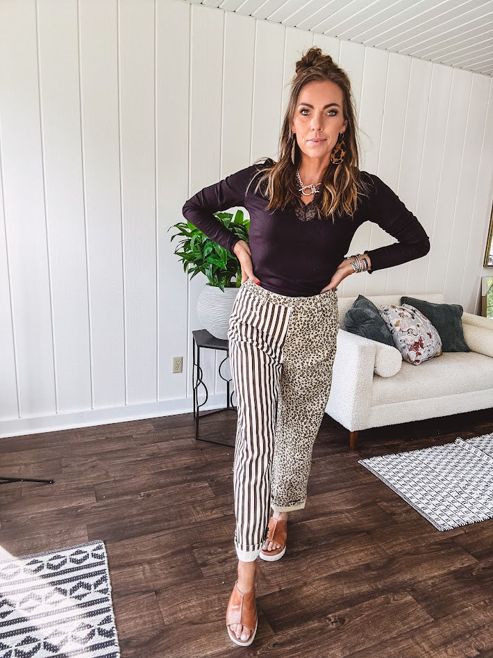  The MIX MATCH LEOPARD STRIPE PANT blends bold brown and cream stripes on one leg with fierce leopard print on the other—all in a soft, denim-like fabric that feels as good as it looks. The elastic back waist keeps you comfy while the button and zipper front keeps things polished. 