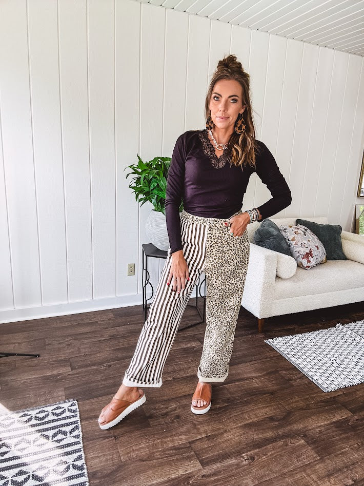  The MIX MATCH LEOPARD STRIPE PANT blends bold brown and cream stripes on one leg with fierce leopard print on the other—all in a soft, denim-like fabric that feels as good as it looks. The elastic back waist keeps you comfy while the button and zipper front keeps things polished. 