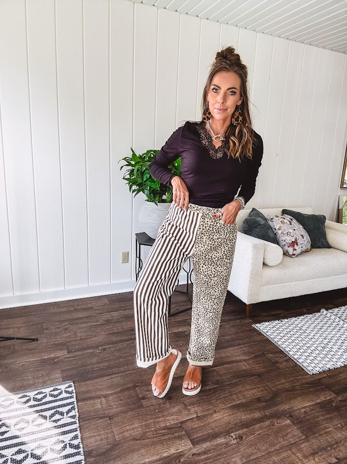  The MIX MATCH LEOPARD STRIPE PANT blends bold brown and cream stripes on one leg with fierce leopard print on the other—all in a soft, denim-like fabric that feels as good as it looks. The elastic back waist keeps you comfy while the button and zipper front keeps things polished. 