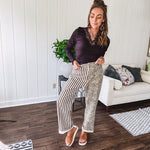  The MIX MATCH LEOPARD STRIPE PANT blends bold brown and cream stripes on one leg with fierce leopard print on the other—all in a soft, denim-like fabric that feels as good as it looks. The elastic back waist keeps you comfy while the button and zipper front keeps things polished. 