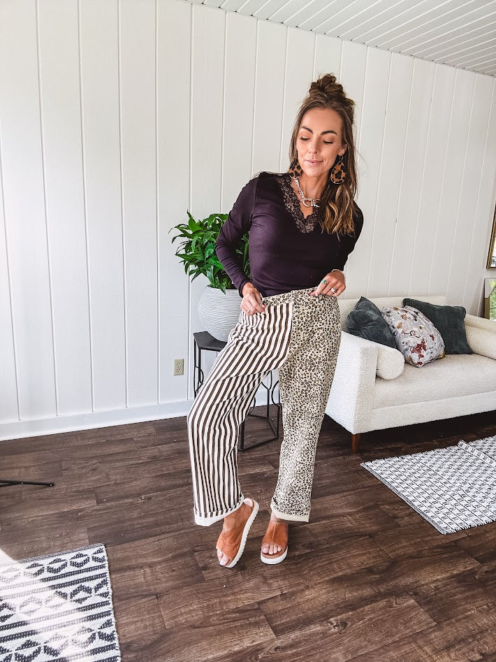  The MIX MATCH LEOPARD STRIPE PANT blends bold brown and cream stripes on one leg with fierce leopard print on the other—all in a soft, denim-like fabric that feels as good as it looks. The elastic back waist keeps you comfy while the button and zipper front keeps things polished. 
