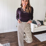  The MIX MATCH LEOPARD STRIPE PANT blends bold brown and cream stripes on one leg with fierce leopard print on the other—all in a soft, denim-like fabric that feels as good as it looks. The elastic back waist keeps you comfy while the button and zipper front keeps things polished. 