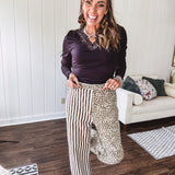  The MIX MATCH LEOPARD STRIPE PANT blends bold brown and cream stripes on one leg with fierce leopard print on the other—all in a soft, denim-like fabric that feels as good as it looks. The elastic back waist keeps you comfy while the button and zipper front keeps things polished. 