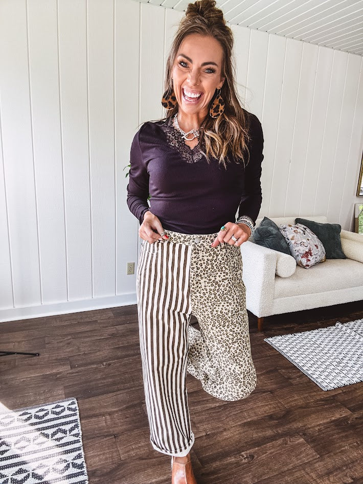  The MIX MATCH LEOPARD STRIPE PANT blends bold brown and cream stripes on one leg with fierce leopard print on the other—all in a soft, denim-like fabric that feels as good as it looks. The elastic back waist keeps you comfy while the button and zipper front keeps things polished. 