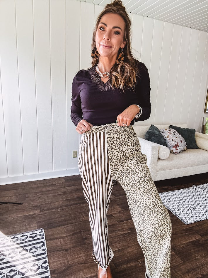  The MIX MATCH LEOPARD STRIPE PANT blends bold brown and cream stripes on one leg with fierce leopard print on the other—all in a soft, denim-like fabric that feels as good as it looks. The elastic back waist keeps you comfy while the button and zipper front keeps things polished. 
