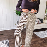  The MIX MATCH LEOPARD STRIPE PANT blends bold brown and cream stripes on one leg with fierce leopard print on the other—all in a soft, denim-like fabric that feels as good as it looks. The elastic back waist keeps you comfy while the button and zipper front keeps things polished. 