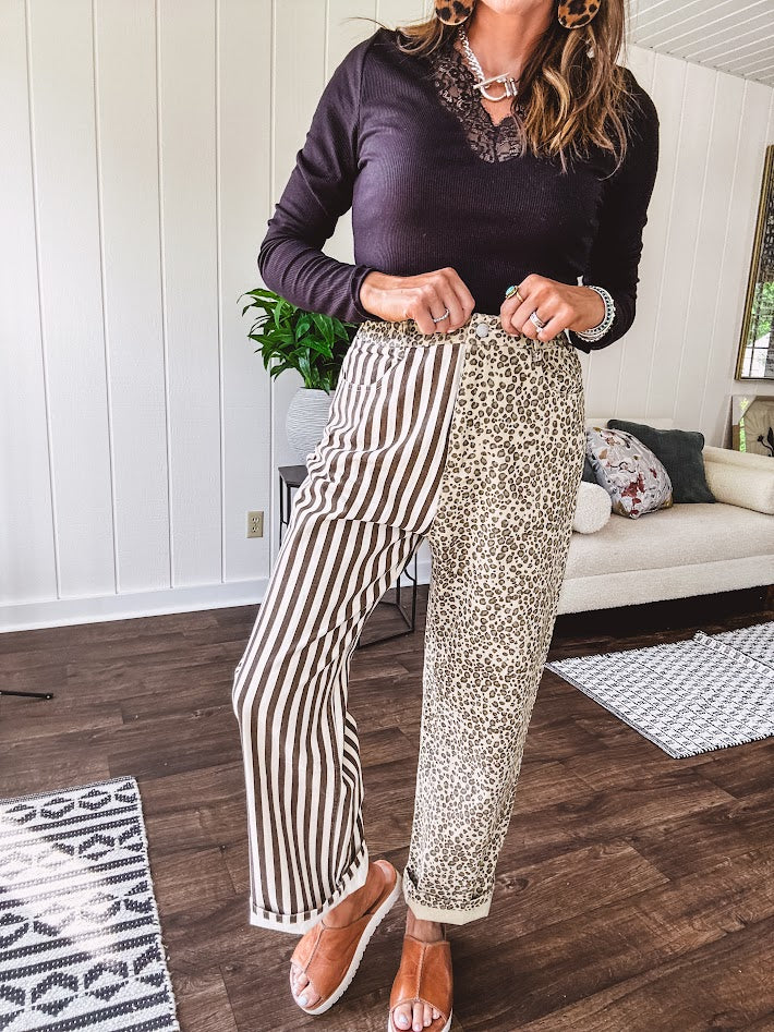  The MIX MATCH LEOPARD STRIPE PANT blends bold brown and cream stripes on one leg with fierce leopard print on the other—all in a soft, denim-like fabric that feels as good as it looks. The elastic back waist keeps you comfy while the button and zipper front keeps things polished. 