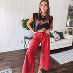 These vintage-inspired wide leg pants are a total vibe—low-rise silhouette with playful silver eyelets and studs running down the sides that catch the light just right. Crafted from lightweight 100% cotton denim with that perfect worn-in wash. The button and zipper closure with elastic back waist keeps them comfortable all day long. Ultra-wide legs that make a statement.