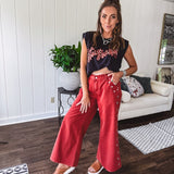 These vintage-inspired wide leg pants are a total vibe—low-rise silhouette with playful silver eyelets and studs running down the sides that catch the light just right. Crafted from lightweight 100% cotton denim with that perfect worn-in wash. The button and zipper closure with elastic back waist keeps them comfortable all day long. Ultra-wide legs that make a statement.