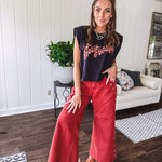 These vintage-inspired wide leg pants are a total vibe—low-rise silhouette with playful silver eyelets and studs running down the sides that catch the light just right. Crafted from lightweight 100% cotton denim with that perfect worn-in wash. The button and zipper closure with elastic back waist keeps them comfortable all day long. Ultra-wide legs that make a statement.